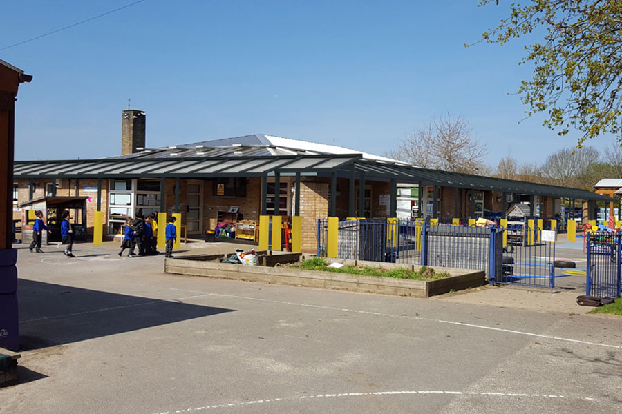 School building after a large canopy was superimposed