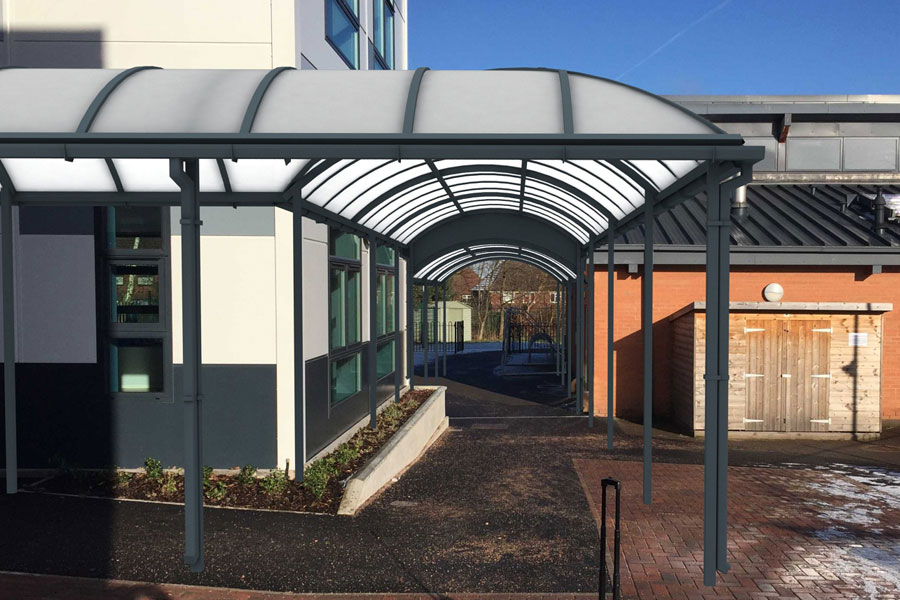 School walkway with a proposed covered canopy superimposed